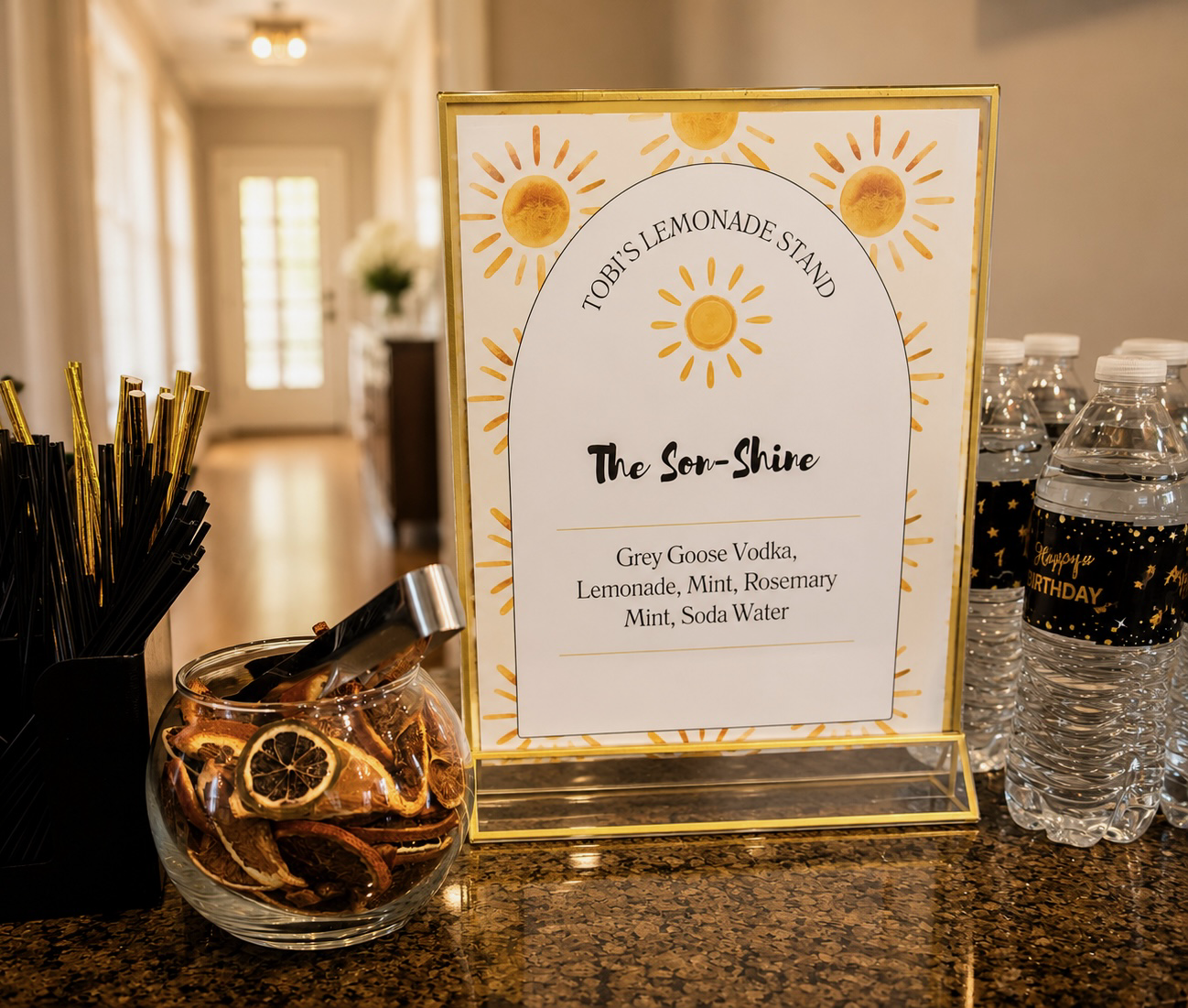 Tobi's lemonade stand menu with dried citrus garnish and birthday water bottles