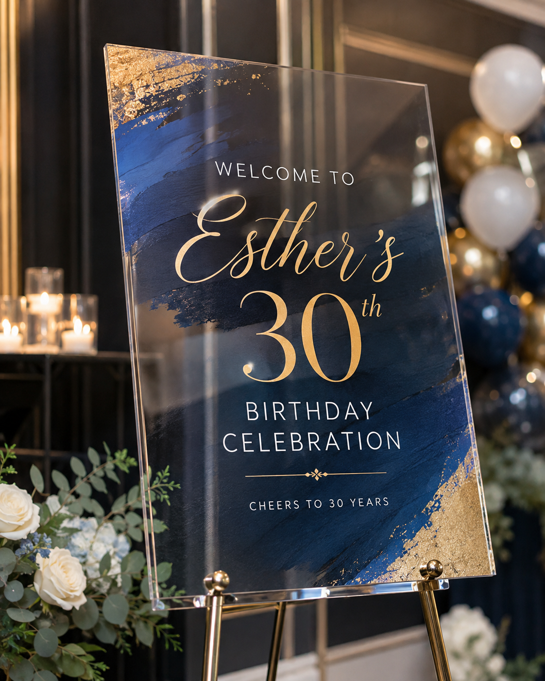 Custom welcome sign styled with greenery and candles